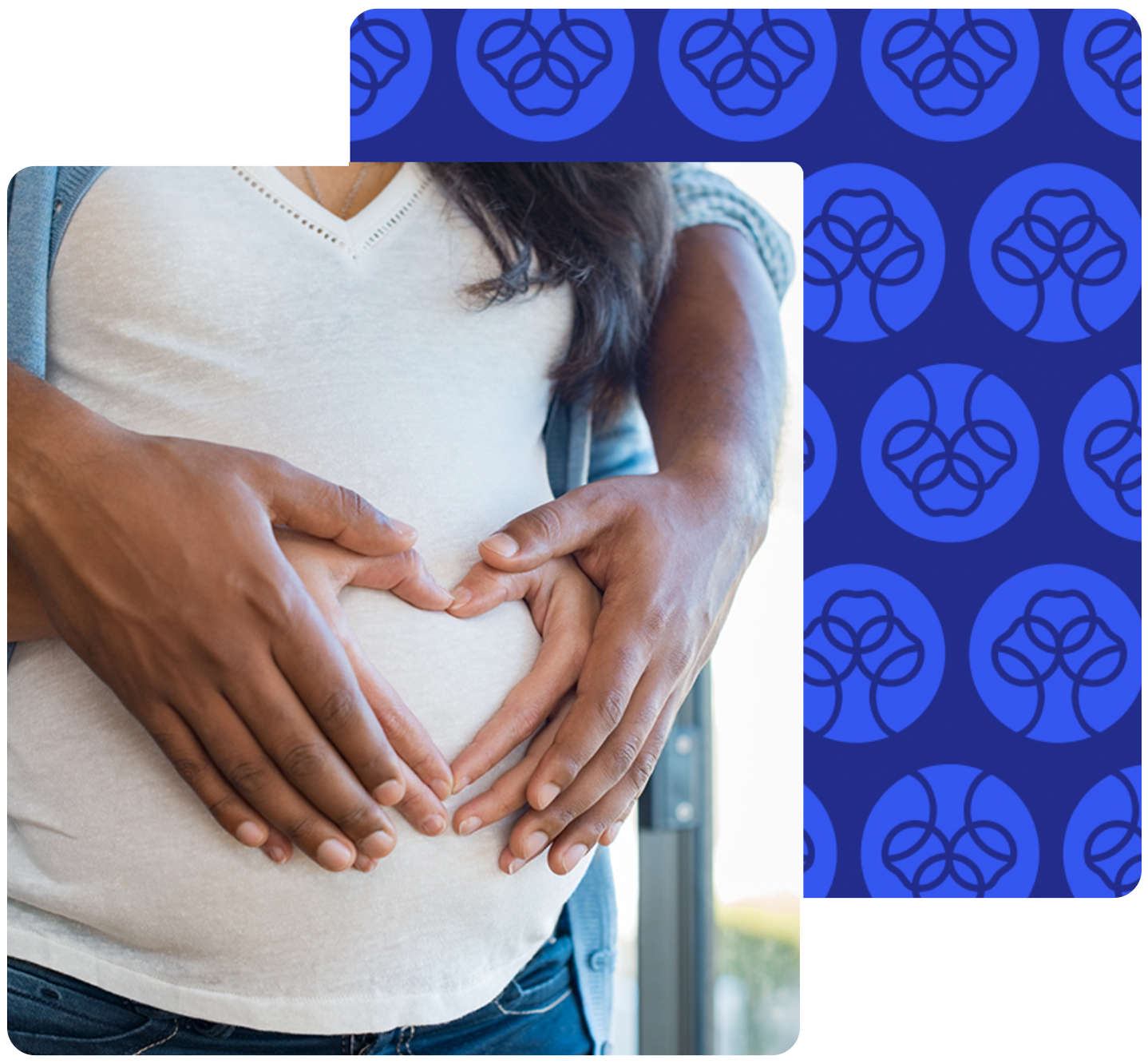 Man and woman with hands in heart shape on pregnant woman's stomach